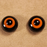 Глаза черно-оранжевые 15 (стекло, 12 мм)
